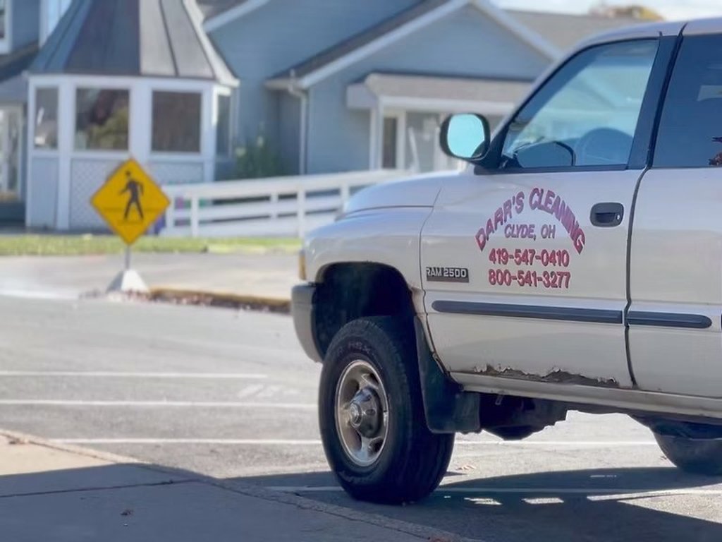 Darr's truck on a residential street during a sewer smoke test